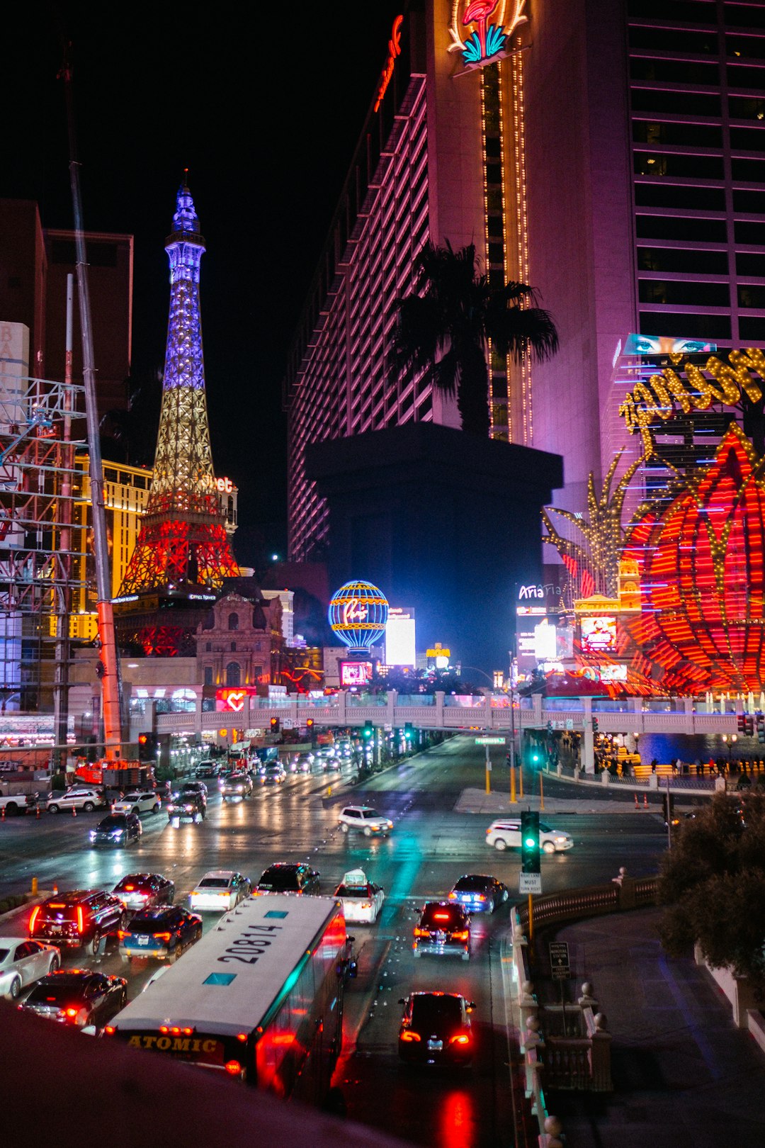 about-us The bridges over the Las Vegas Strip are lined with plexiglass. Shooting through the glass made for an interesting composite image. The Flamingo Hotel and silhouette palm tree were in fact behind me me when I took this photo.