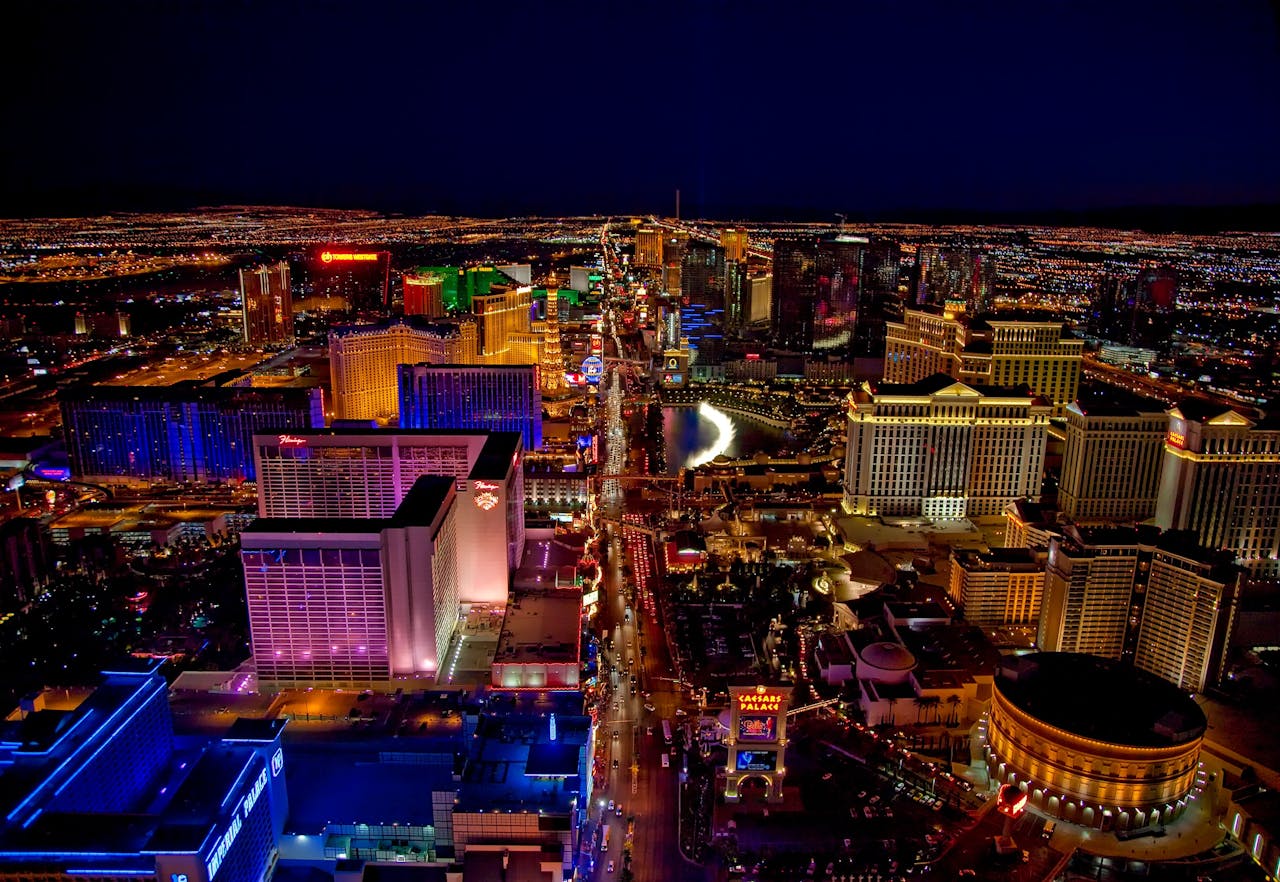 our-story Stunning aerial view of Las Vegas Strip glowing at night with vibrant neon lights and bustling nightlife.